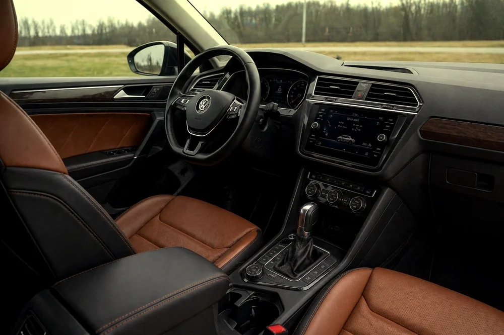 Clean black interior with brown leather seats